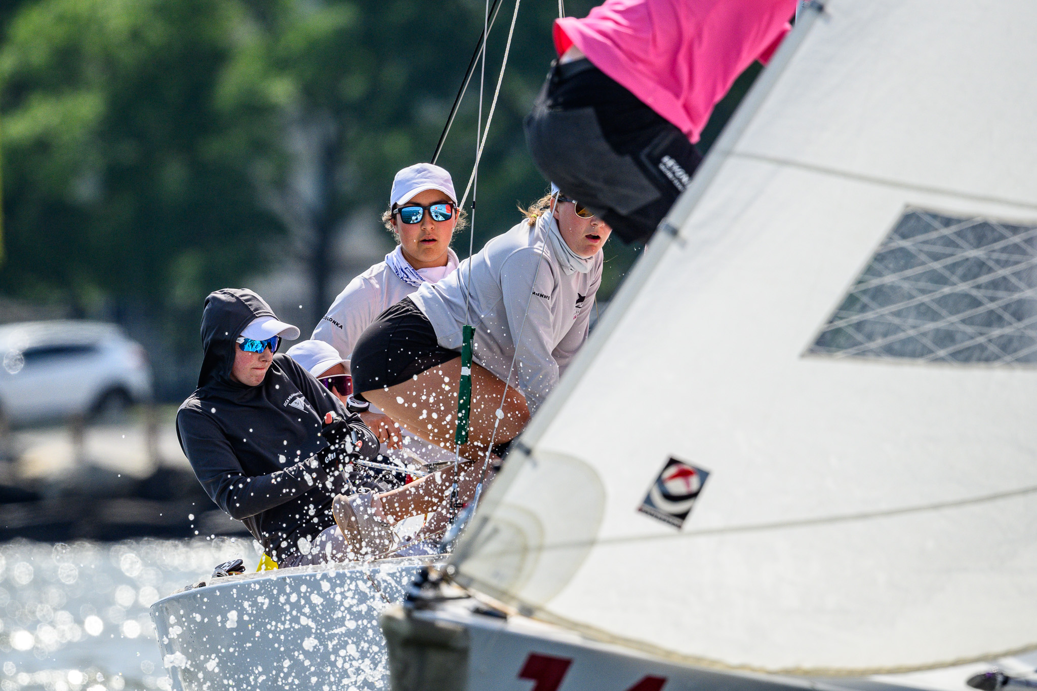 Crew working through spray during a race